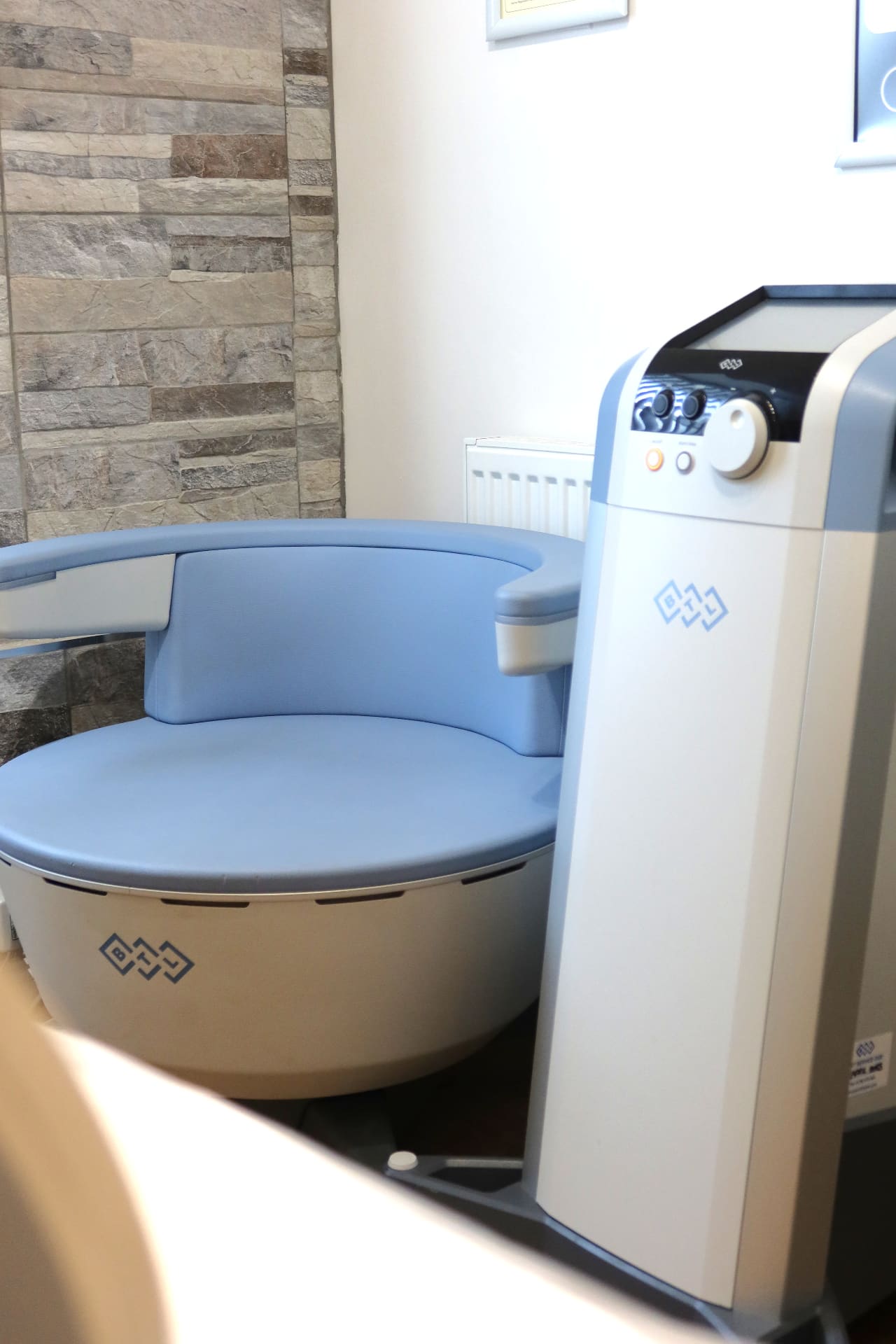 Practitioner with BTL Emsella equipment